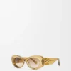 Abgeschrägte ovale Maxi Anagram Sonnenbrille Transparent Olive