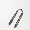 Anagram-Riemen aus Jacquard und Kalbsleder Schwarz/Gold