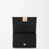 Anagram Visitenkartenetui aus genarbtem Kalbsleder Black/Gold