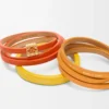 Doppelt gewundenes Armband aus Kalbsleder in leuchtendem Orange/Gelb