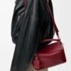 Kleine Featherlight Puzzle Tasche aus Nappalammleder in Burnt Red