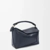 Kleine Puzzle Edge Tasche aus weichem genarbtem Kalbsleder Deep Navy