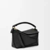 Kleine Puzzle Edge Tasche aus weichem genarbtem Kalbsleder in Schwarz