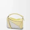 Kleine Puzzle-Tasche aus Nappakalbsleder in Hellgrau/Hellcitrin