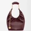 Kleine Squeeze-Tasche aus weichem Nappalammleder in Dunkelburgunder