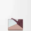 Kompakte Geldbörse „Puzzle” aus klassischem Kalbsleder in Frozen/Dark Burgundy