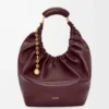 Medium Squeeze Tasche aus weichem Nappalammleder in Dunkelburgunder