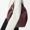 Medium Squeeze Tasche aus weichem Nappalammleder in Dunkelburgunder