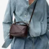 Mini Featherlight Puzzle Tasche aus Nappalammleder in Dark Chestnut