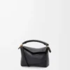 Mini Puzzle Edge Tasche aus weichem genarbtem Kalbsleder Schwarz