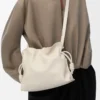 Mittlere Flamenco-Clutch aus Nappakalbsleder Sea Salt
