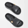 Schaumstoff-Pebble-Pantolette Schwarz/Gold