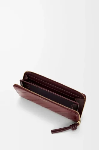 Schmale Rundum-Geldbörse mit Knotenverschluss aus Aal Dark Burgundy