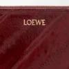 Schmale Rundum-Geldbörse mit Knotenverschluss aus Aal Dark Burgundy